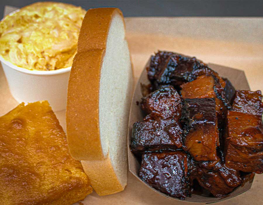 Tray with burnt ends, sliced white bread, mac and cheese from Klinger's Real BBQ Menu.